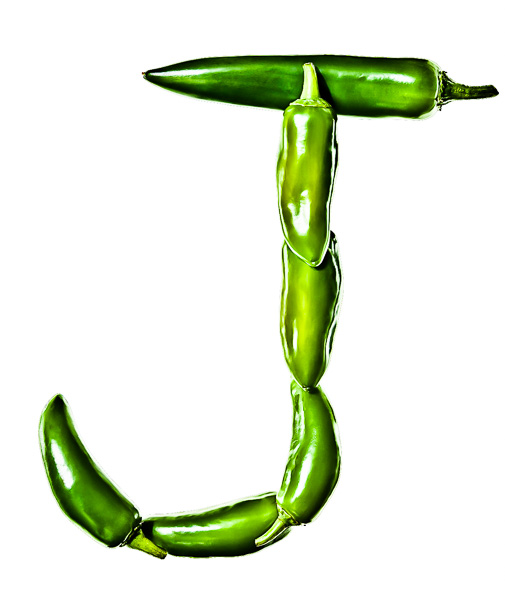 Photo of Green Jalapeño Peppers, laid out in the shape of the letter "J"