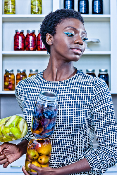 Fashion image of woman with jars of preserved fruit. © 2014 Dana Hursey Photography