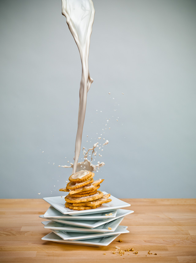 Photo of milk being poured onto a stack of cookies