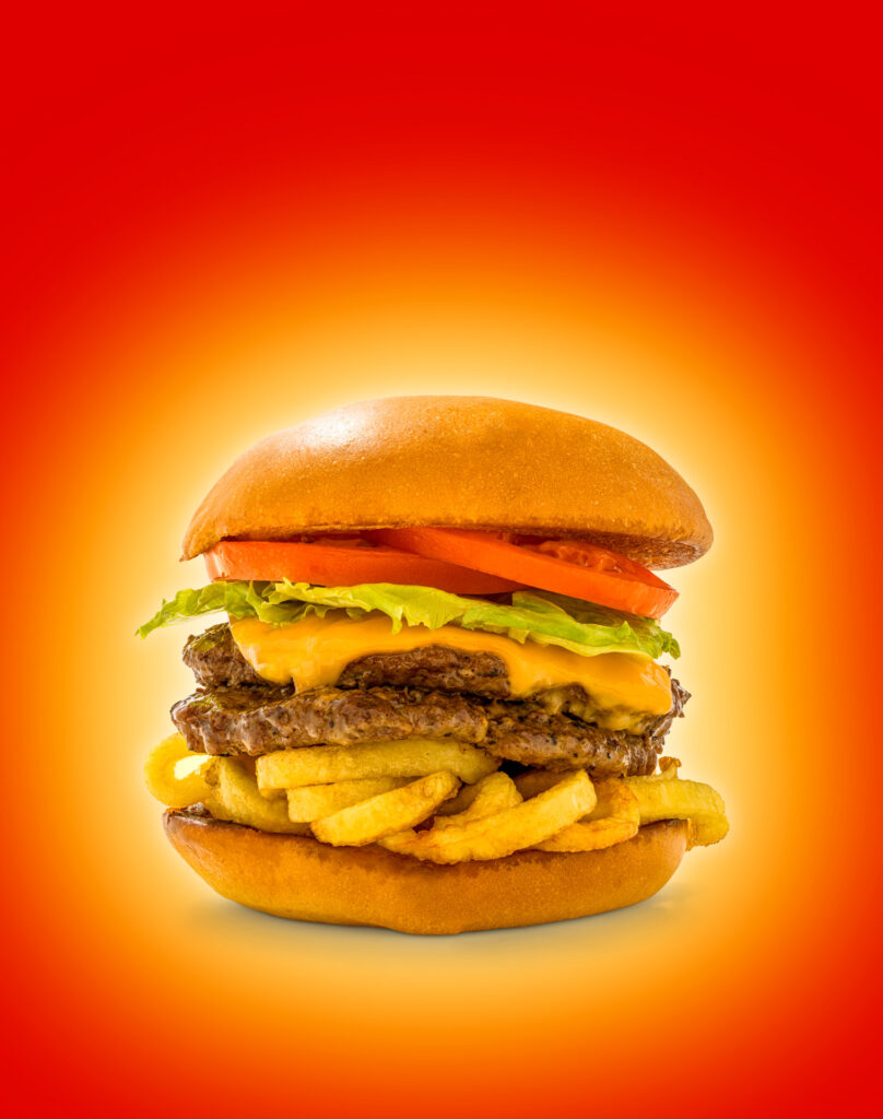 Photograph of a juicy cheeseburger.
